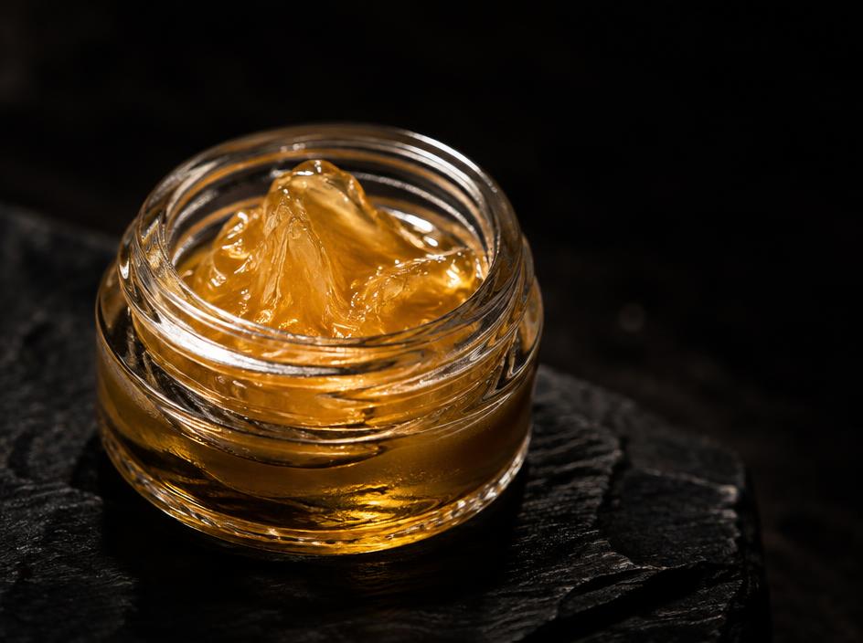 Golden cold cure live rosin in a small glass jar